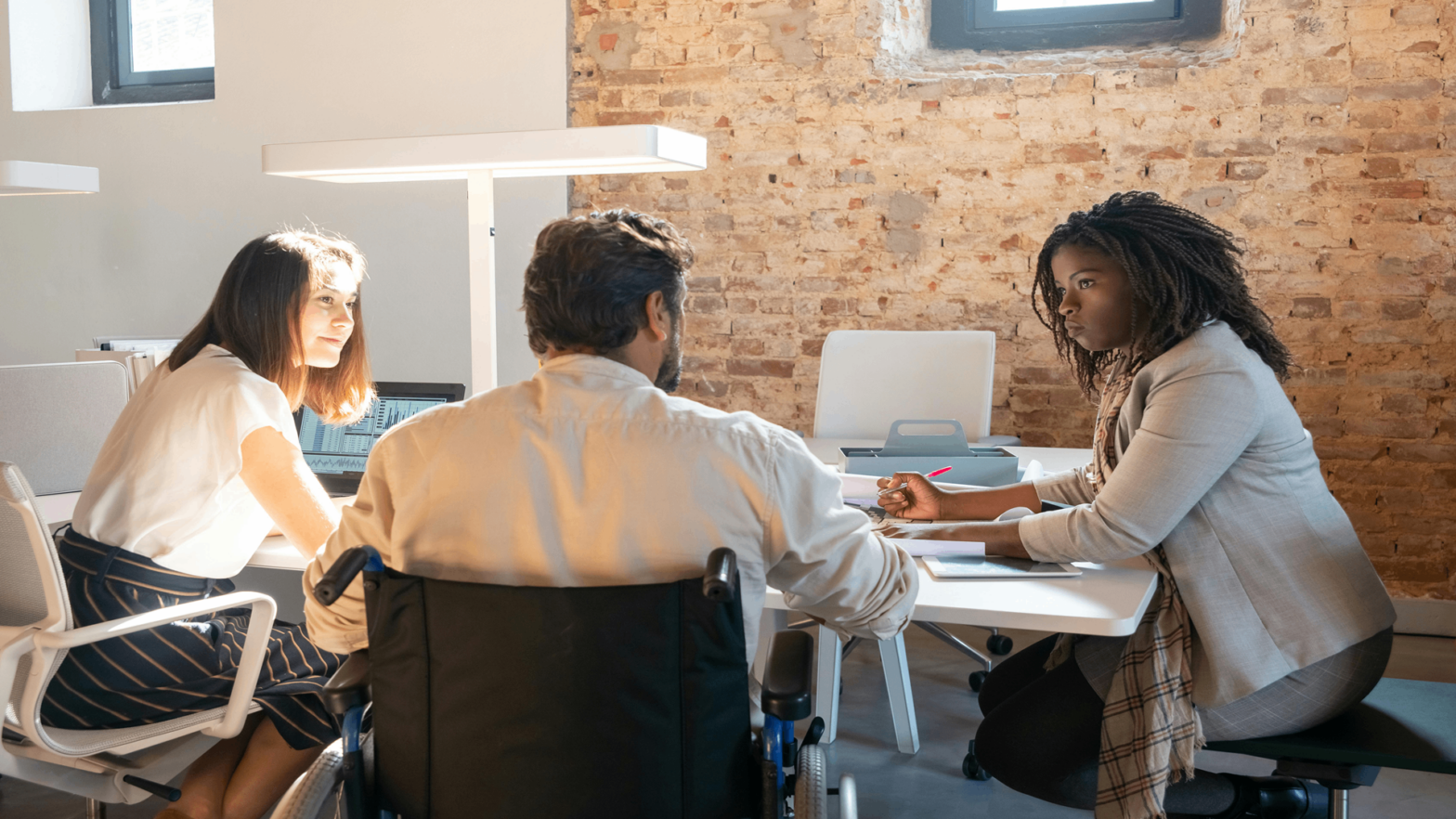 Inclusive workplace environment reflecting accessibility and collaboration within a modern customer service setting in Wales.